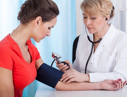 nurse using sphygmomanometers 